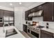 Gourmet kitchen features stainless appliances, gas range, and plenty of counter space at 9922 E Thunderbolt Ave, Mesa, AZ 85212