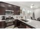 Well-equipped kitchen features stainless steel appliances and quartz countertops at 9922 E Thunderbolt Ave, Mesa, AZ 85212