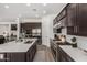 Well-designed kitchen with a large island, stainless steel range, and ample cabinet space at 9922 E Thunderbolt Ave, Mesa, AZ 85212