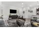 Comfortable living room featuring modern furnishings and a large flat-screen TV at 9922 E Thunderbolt Ave, Mesa, AZ 85212