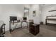 Home office featuring a large desk, comfortable chair and ample natural light at 9922 E Thunderbolt Ave, Mesa, AZ 85212