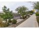 Walking path with benches surrounded by desert landscaping in a well-maintained community park at 9922 E Thunderbolt Ave, Mesa, AZ 85212