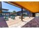 Relaxing covered patio with comfortable seating, a charming fountain, and scenic views of the surrounding community at 9922 E Thunderbolt Ave, Mesa, AZ 85212