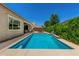 Inviting backyard pool surrounded by a patio, perfect for enjoying sunny days and outdoor living at 9922 E Thunderbolt Ave, Mesa, AZ 85212