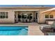 Outdoor pool and patio area with a dining set and lounge chairs, perfect for entertaining at 9922 E Thunderbolt Ave, Mesa, AZ 85212