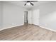Bedroom featuring a ceiling fan, closet with sliding doors, gray walls, and wood-look flooring at 1015 E Penny Ln, San Tan Valley, AZ 85140