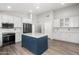 Contemporary kitchen showcasing a center island, updated appliances, and ample cabinet space at 1015 E Penny Ln, San Tan Valley, AZ 85140