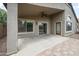 Covered patio with brick and concrete flooring, ceiling fan and access to the house at 1015 E Penny Ln, San Tan Valley, AZ 85140