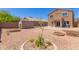 Large backyard featuring a storage shed, gravel landscaping, a covered patio, and mature trees at 10745 W Taft St, Phoenix, AZ 85037
