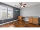 Bedroom with a window view and built-in workspace for organization and productivity at 10745 W Taft St, Phoenix, AZ 85037