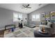 Spacious exercise room featuring workout equipment, natural light from windows, and neutral tones at 10745 W Taft St, Phoenix, AZ 85037