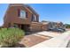 Charming two-story home features a two-car garage and well-maintained front yard with stone pathway at 10745 W Taft St, Phoenix, AZ 85037