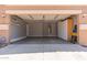 Spacious two-car garage with epoxy flooring, built-in storage, and ample room for vehicles and projects at 10745 W Taft St, Phoenix, AZ 85037