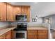 Kitchen with stainless steel appliances, granite countertops, and hardwood cabinets at 10745 W Taft St, Phoenix, AZ 85037