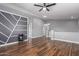 Large living room with recessed lighting, a ceiling fan, and hardwood floors at 10745 W Taft St, Phoenix, AZ 85037