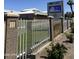 The ASU Preparatory Academy features brick and white metal fencing for a secure campus perimeter at 1110 E Pierce St, Phoenix, AZ 85006