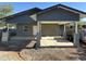 An exterior shot of a home featuring stucco walls, covered parking and fresh concrete at 1110 E Pierce St, Phoenix, AZ 85006