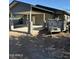 An exterior shot of a home featuring stucco walls, covered parking, and fresh concrete at 1110 E Pierce St, Phoenix, AZ 85006