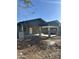An exterior shot of a house with stucco walls, fresh concrete, and a covered carport at 1110 E Pierce St, Phoenix, AZ 85006