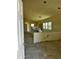 An interior view with an open doorway, showing bare floors, and abundant natural light at 1110 E Pierce St, Phoenix, AZ 85006