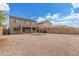 Spacious backyard with gravel ground cover, offering ample space for outdoor activities and landscaping at 11132 W Mariposa Dr, Phoenix, AZ 85037