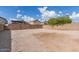 Large gravel backyard enclosed by a block wall fence, offering privacy and ample space at 11132 W Mariposa Dr, Phoenix, AZ 85037