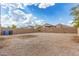 Expansive backyard with a gravel ground cover, surrounded by a block fence for privacy at 11132 W Mariposa Dr, Phoenix, AZ 85037
