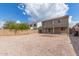 Expansive backyard featuring gravel, block wall fencing, and a covered patio, perfect for outdoor living at 11132 W Mariposa Dr, Phoenix, AZ 85037