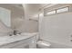The bathroom offers a large rounded mirror, and a shower-tub combo with updated faucet fixtures at 11132 W Mariposa Dr, Phoenix, AZ 85037