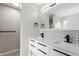 Modern bathroom features a double vanity with sleek fixtures and hardware at 11132 W Mariposa Dr, Phoenix, AZ 85037