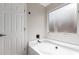 Bathtub in bathroom features sleek fixtures, paint and natural lighting at 11132 W Mariposa Dr, Phoenix, AZ 85037