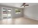 Neutral bedroom with natural light and sliding doors to a patio at 11132 W Mariposa Dr, Phoenix, AZ 85037