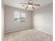 Bedroom with carpet, neutral paint, a ceiling fan, and a window at 11132 W Mariposa Dr, Phoenix, AZ 85037