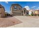 Beautiful two-story house with a two car garage and desert landscaping at 11132 W Mariposa Dr, Phoenix, AZ 85037