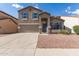 Charming two-story home featuring blue shutters and a two-car garage at 11132 W Mariposa Dr, Phoenix, AZ 85037
