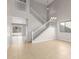 Bright living room features soaring ceilings, staircase, and tile floors at 11132 W Mariposa Dr, Phoenix, AZ 85037