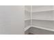 Walk-in pantry features multiple shelves for ample storage space at 11132 W Mariposa Dr, Phoenix, AZ 85037