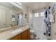 Bathroom with granite countertop, framed mirror, shower/tub combo, and natural light at 11680 E Sahuaro Dr # 1059, Scottsdale, AZ 85259