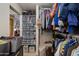 Organized walk-in closet with shelves full of shoes, rods, and closet accessories at 11680 E Sahuaro Dr # 1059, Scottsdale, AZ 85259