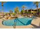Refreshing community pool with waterfall feature and lush landscaping, perfect for relaxation and recreation under the sun at 11680 E Sahuaro Dr # 1059, Scottsdale, AZ 85259