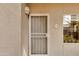 Secured front door entrance with security screen and building unit number, enhancing privacy and safety at 11680 E Sahuaro Dr # 1059, Scottsdale, AZ 85259
