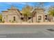Attractive exterior view of a multi-unit residential building with desert landscaping and paved walkway at 11680 E Sahuaro Dr # 1059, Scottsdale, AZ 85259