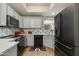 Bright kitchen boasting stainless steel appliances, sleek white cabinetry, and a modern backsplash at 11680 E Sahuaro Dr # 1059, Scottsdale, AZ 85259