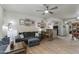 Cozy living room with gray sofa, wood floors, breakfast bar, and easy access to the kitchen at 11680 E Sahuaro Dr # 1059, Scottsdale, AZ 85259