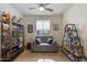 Cozy living room with ceiling fan, light gray sofa, and decorative shelving at 11680 E Sahuaro Dr # 1059, Scottsdale, AZ 85259