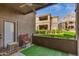 Cozy outdoor patio space with artificial turf and views of the well-maintained lawn and complex at 11680 E Sahuaro Dr # 1059, Scottsdale, AZ 85259