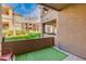 Covered balcony overlooking courtyard with well maintained grass and desert landscaping at 11680 E Sahuaro Dr # 1059, Scottsdale, AZ 85259