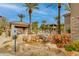 Beautiful pool area features a cabana, rock waterfall, and lush landscaping, creating a relaxing oasis in the community at 11680 E Sahuaro Dr # 1059, Scottsdale, AZ 85259