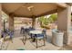 Comfortable poolside cabana offers shade and seating near a community pool with lush landscaping and rock features at 11680 E Sahuaro Dr # 1059, Scottsdale, AZ 85259