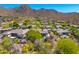 This aerial view highlights the neighborhood, mountain views and lush desert landscaping at 12366 N 129Th St, Scottsdale, AZ 85259